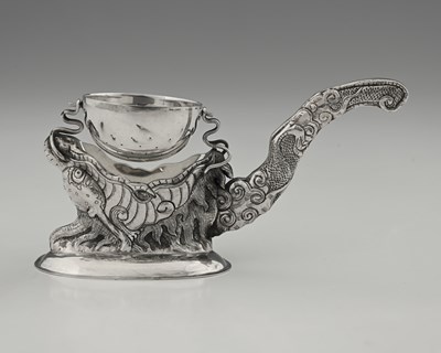 Lot 144 - A South-East Asian silver tea strainer on...