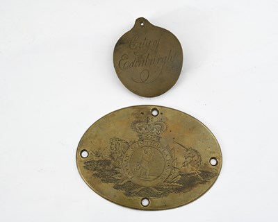 Lot 590 - An oval brass plaque engraved for the...