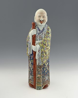 Lot 354 - A Chinese porcelain figure of an elder,...