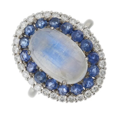 Lot 71 - A platinum moonstone, sapphire and brilliant-cut diamond cluster ring