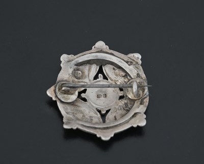Lot 22 - An Arts & Crafts silver enamel brooch