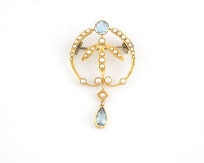 Lot 10 - An Art Nouveau gold aquamarine and split pearl foliate brooch