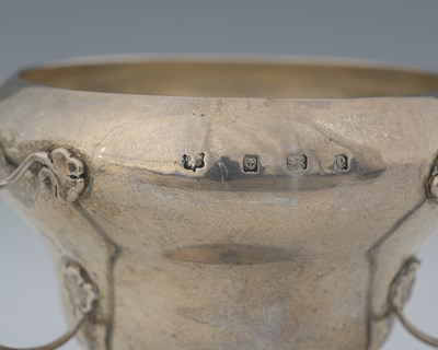 Lot 51 - An Arts and Crafts silver three handled vase,...