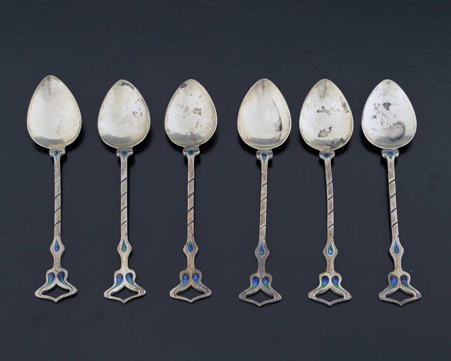 Lot 61 - Archibald Knox for Liberty and Co., a set of...
