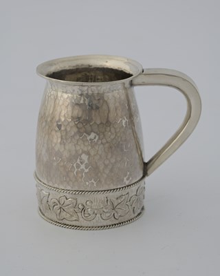 Lot 56 - A E Jones, an Arts and Crafts silver mug,...