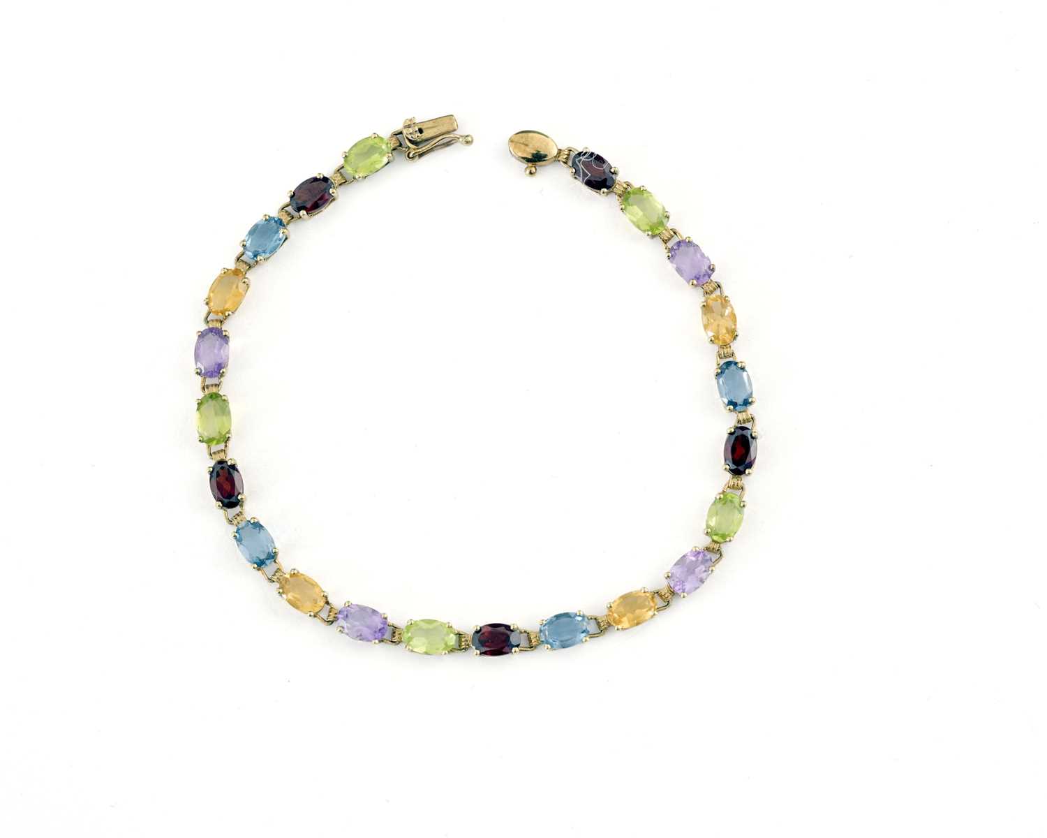 Lot 5 - A 9ct gold harlequin multi-gem line bracelet