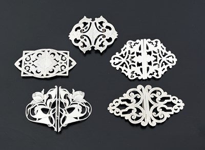 Lot 428 - Four silver buckles, one Art Nouveau example...