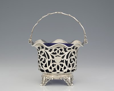 Lot 124 - A Victorian silver swing handle basket, the...