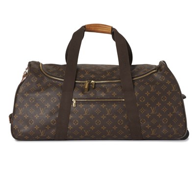 Lot 446 - Louis Vuitton, a monogram Eole 65 rolling luggage bag.