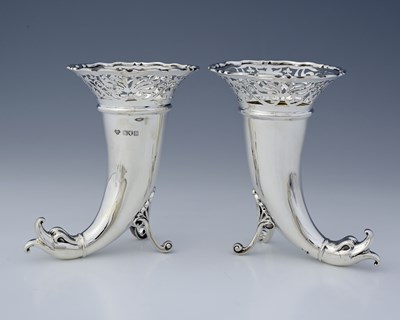 Lot 227 - A pair of Edwardian silver vases, of...