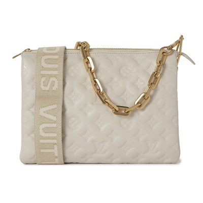Lot 474 - Louis Vuitton, a cream Pochette Coussin PM handbag.