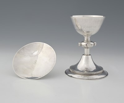 Lot 415 - A George VI silver chalice and matching paten,...