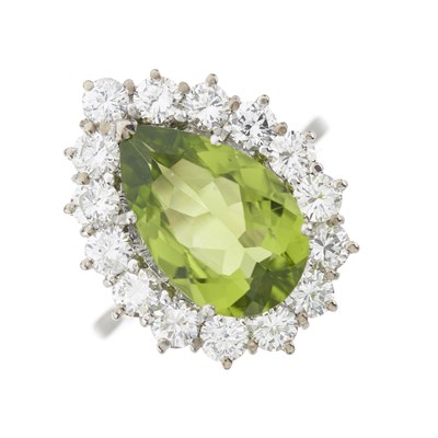 Lot 201 - A platinum peridot and diamond cluster ring