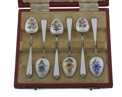 Lot 277 - A cased set of six silver-gilt and enamel...