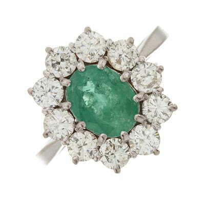 Lot 156 - An 18ct gold emerald and diamond cluster ring
