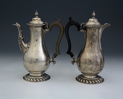 Lot 291 - A pair of George V silver cafe au lait pots,...