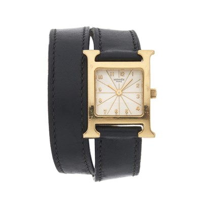 Lot 201 - Hermès, an 18ct gold Heure H Mini wrist watch