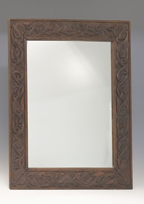 Lot 434 - A carved wood wall mirror probably Irish,...