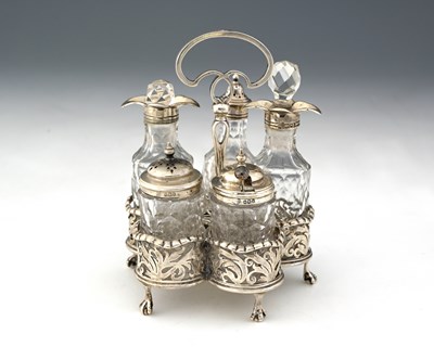 Lot 208 - A George V silver five-bottle condiment set,...