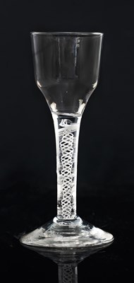 Lot 394 - An opaque twist wine glass, circa 1760, the...