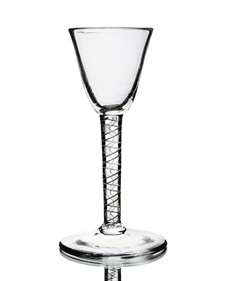 Lot 384 - An opaque twist wine glass, circa 1760, the...