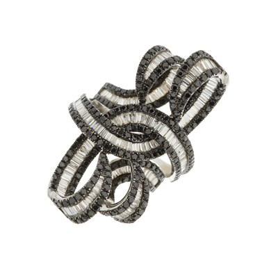 Lot 34 - An 18ct gold diamond and black diamond...
