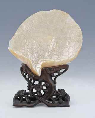 Lot 374 - A Chinese relief carved shell, on a...