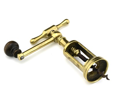 Lot 109 - A brass mechanical coffee grinder cokscrew, of...