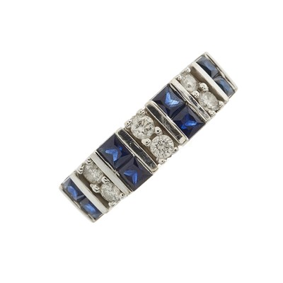 Lot 145 - A 14ct gold calibre-cut sapphire band ring,...