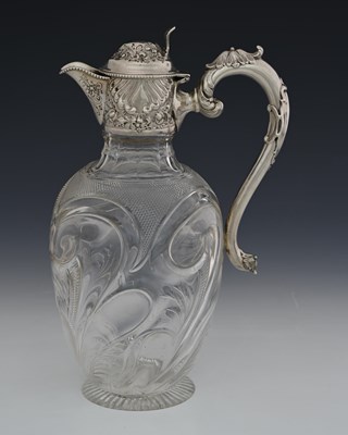 Lot 106 - An Edwardian silver-mounted glass claret jug,...