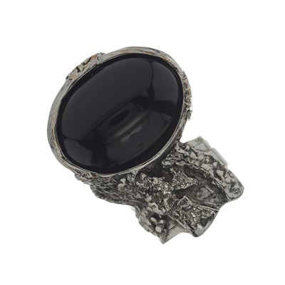 Lot 488 - Yves Saint Laurent, a black paste abstract ring.