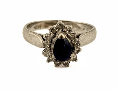Lot 352 - A pear-shape sapphire and single-cut diamond cluster ring