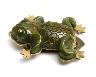 Lot 356 - A green bakelite frog dress clip brooch,...