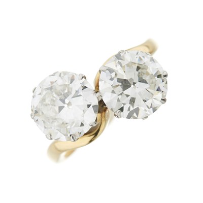 Lot 1 - A transitional brilliant-cut diamond two-stone crossover ring