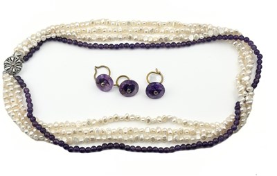 Lot 357 - A freshwater cultured pearl and amethyst necklace with three amethyst buttons