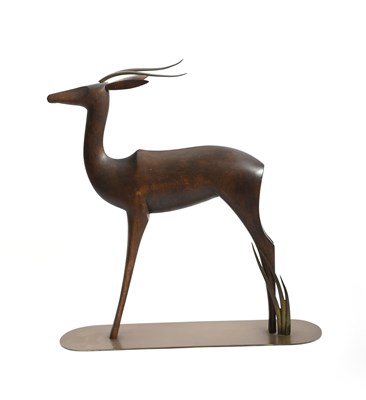 Lot 132 - A Hagenauer Werkstätte patined brass and wood...