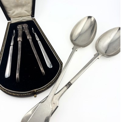 Lot 354 - A plated nutcracker and two picks, with a...