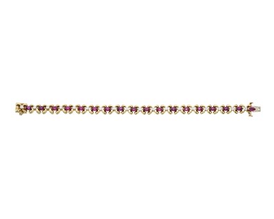 Lot 123 - A marquise shape ruby and brilliant-cut diamond line bracelet