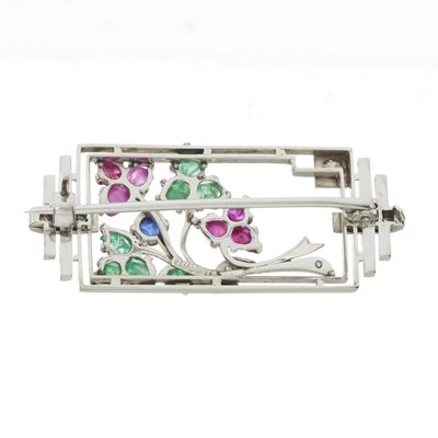 Lot 43 - An Art Deco 18ct gold single-cut diamond, emerald, ruby and sapphire foliate brooch