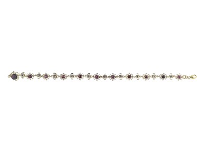 Lot 157 - A Georgian gilt foil-backed garnet and colourless gem bracelet