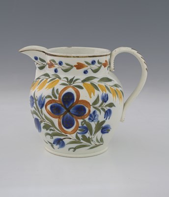Lot 765 - A plychrome Prattware jug, circa 1820, ovoid...
