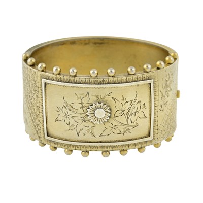 Lot 464 - A late Victorian gilt hinged bangle