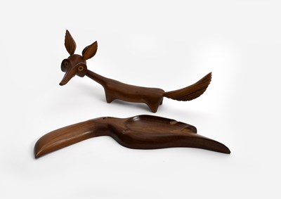 Lot 131 - A carved wood sculpture of a fox in the manner...