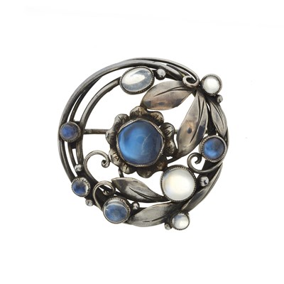 Lot 71 - An Arts and Crafts silver moonstone floral brooch
