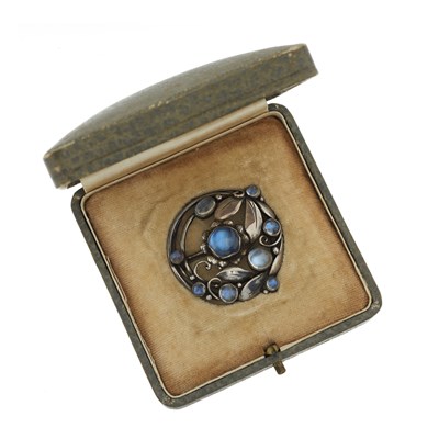Lot 71 - An Arts and Crafts silver moonstone floral brooch