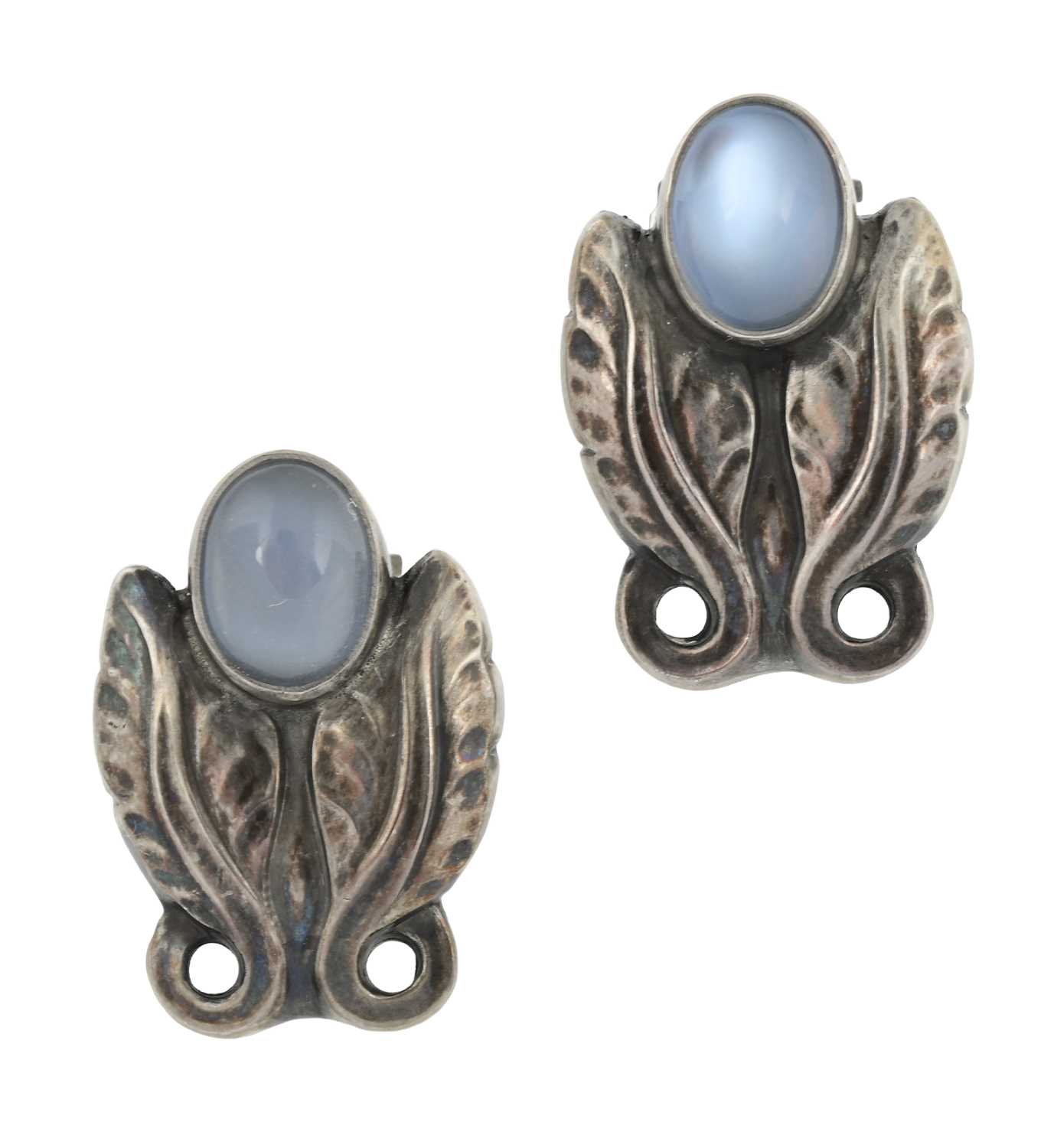 Lot 68 - Georg Jensen, a pair of early 20th century silver moonstone leaf clip-on earrings