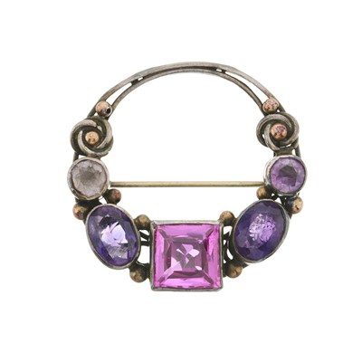 Lot 73 - An Arts and Crafts silver amethyst and synthetic ruby brooch