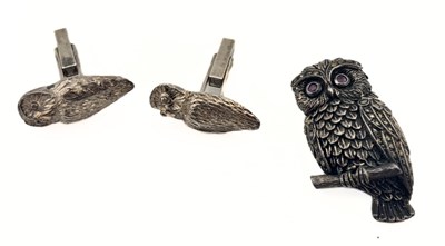 Lot 457 - A silver marcasite and ruby owl brooch and a pair of silver owl cufflinks