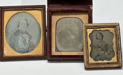 Lot 228 - Two red leather-cased and velvet-lined mirror...