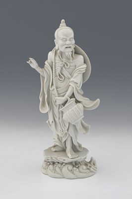Lot 161 - A Chinese Dehua, blanc de Chine figure of a...